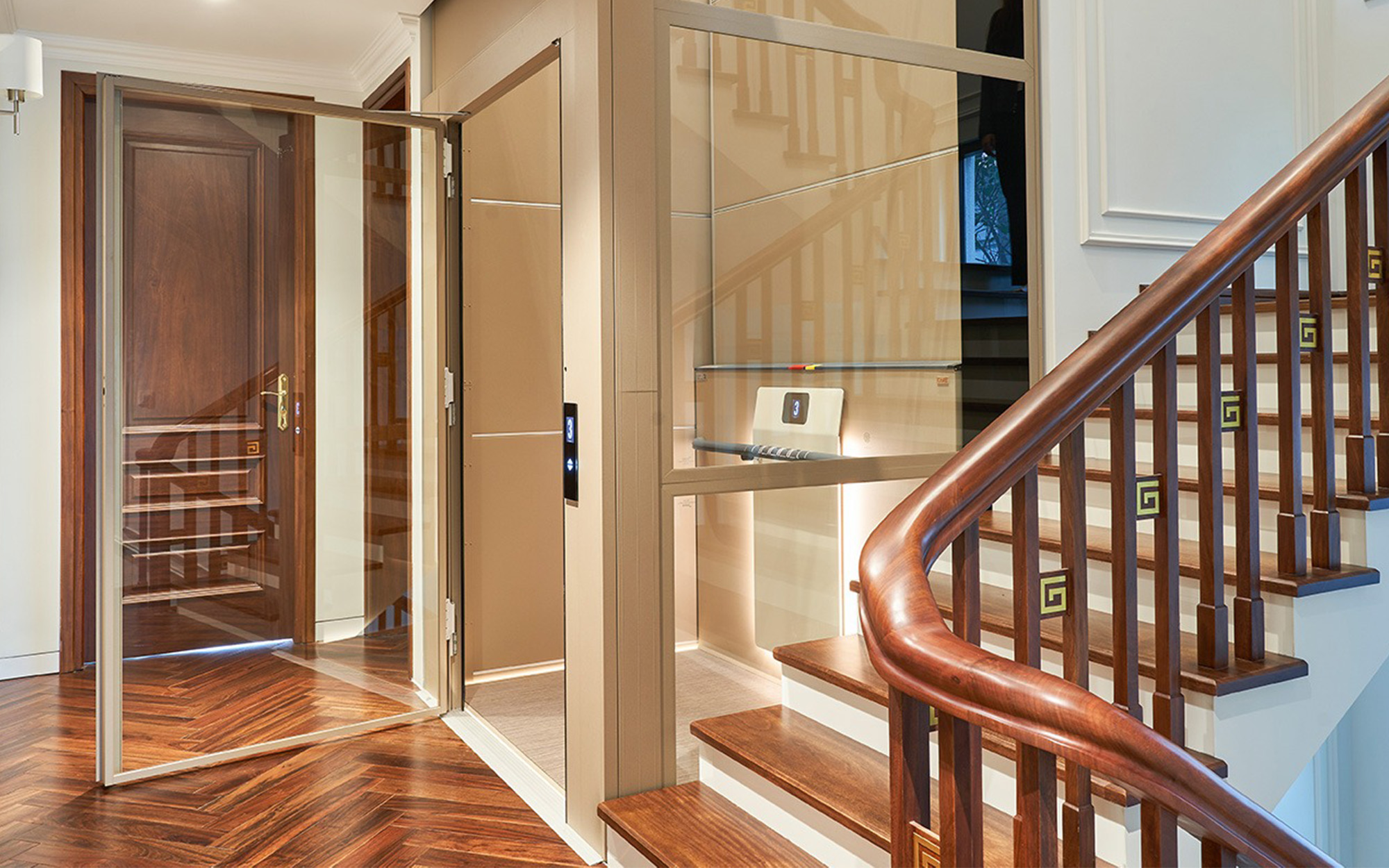 Glass Cibes elevator next to staircase
