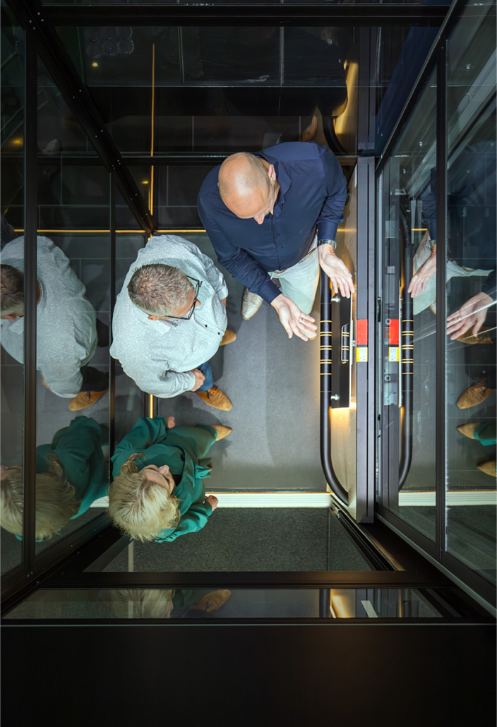 People looking at elevator