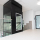 platform lift installed in a commercial building providing wheelchair accessibility between levels